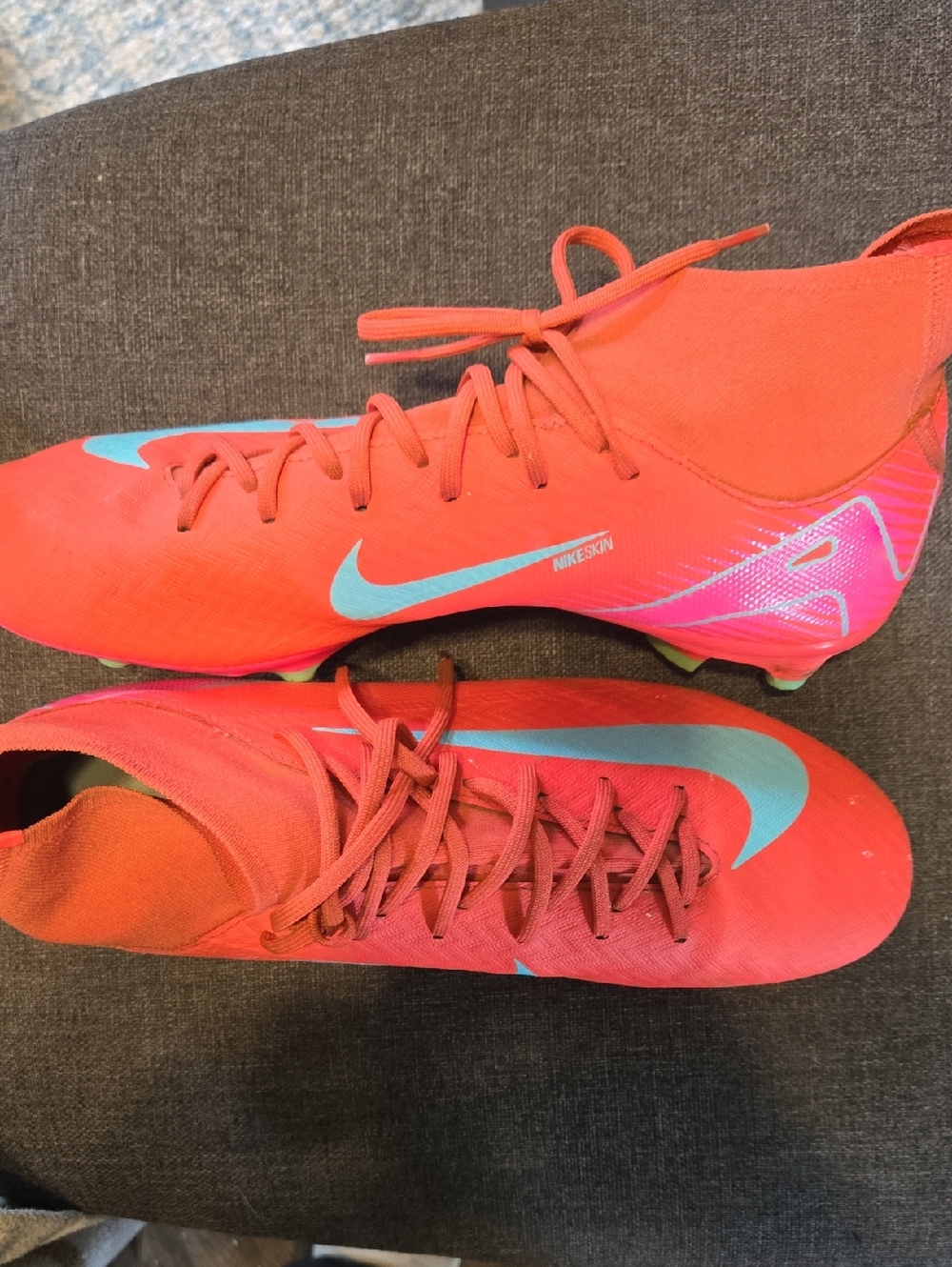 Nike Red Soccer Cleats with Teal Swoosh